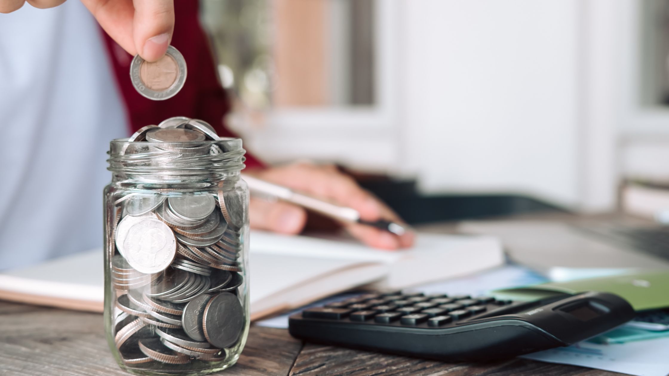 Saving coins in a glass jar