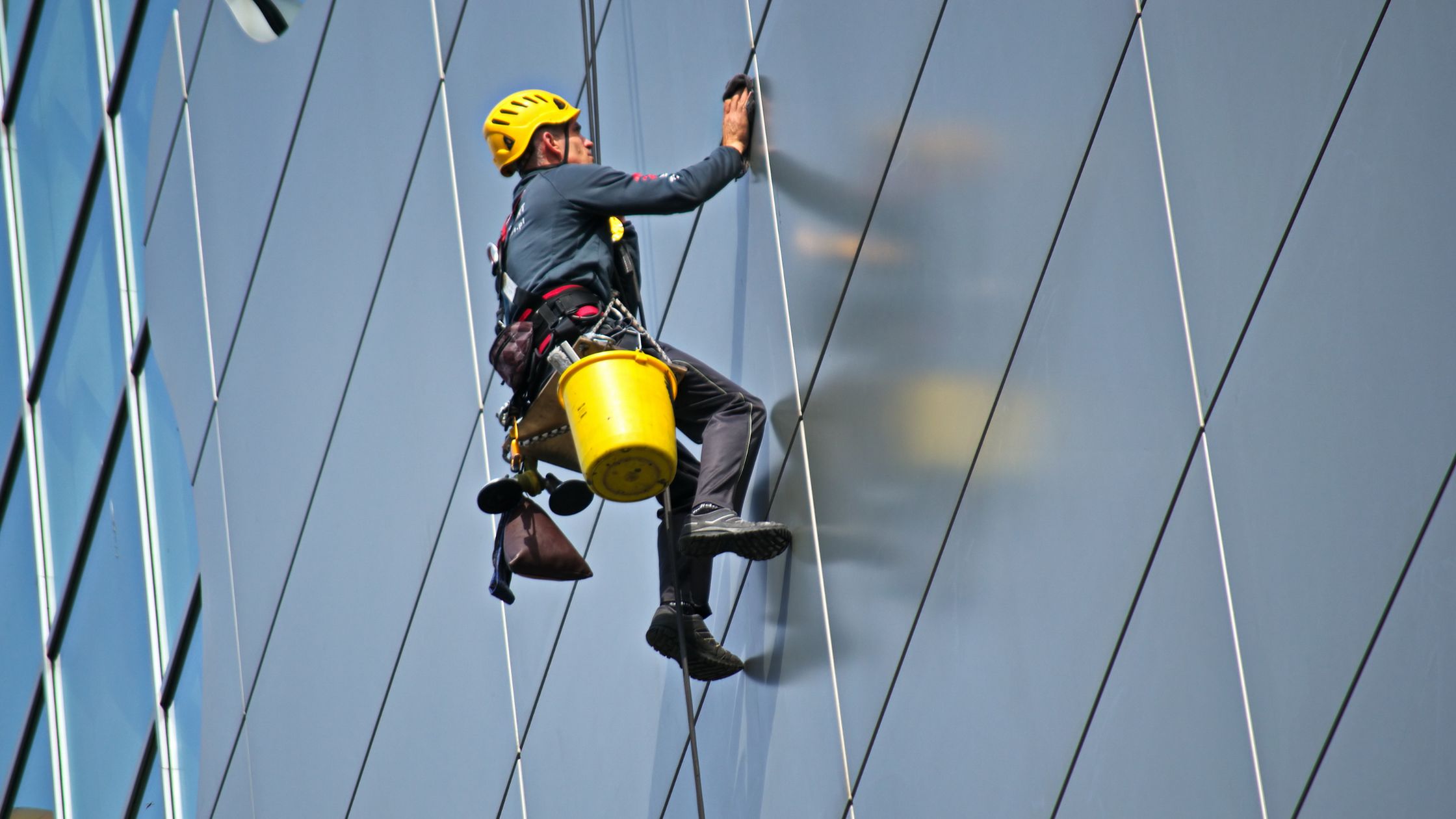 man cleaning a wall