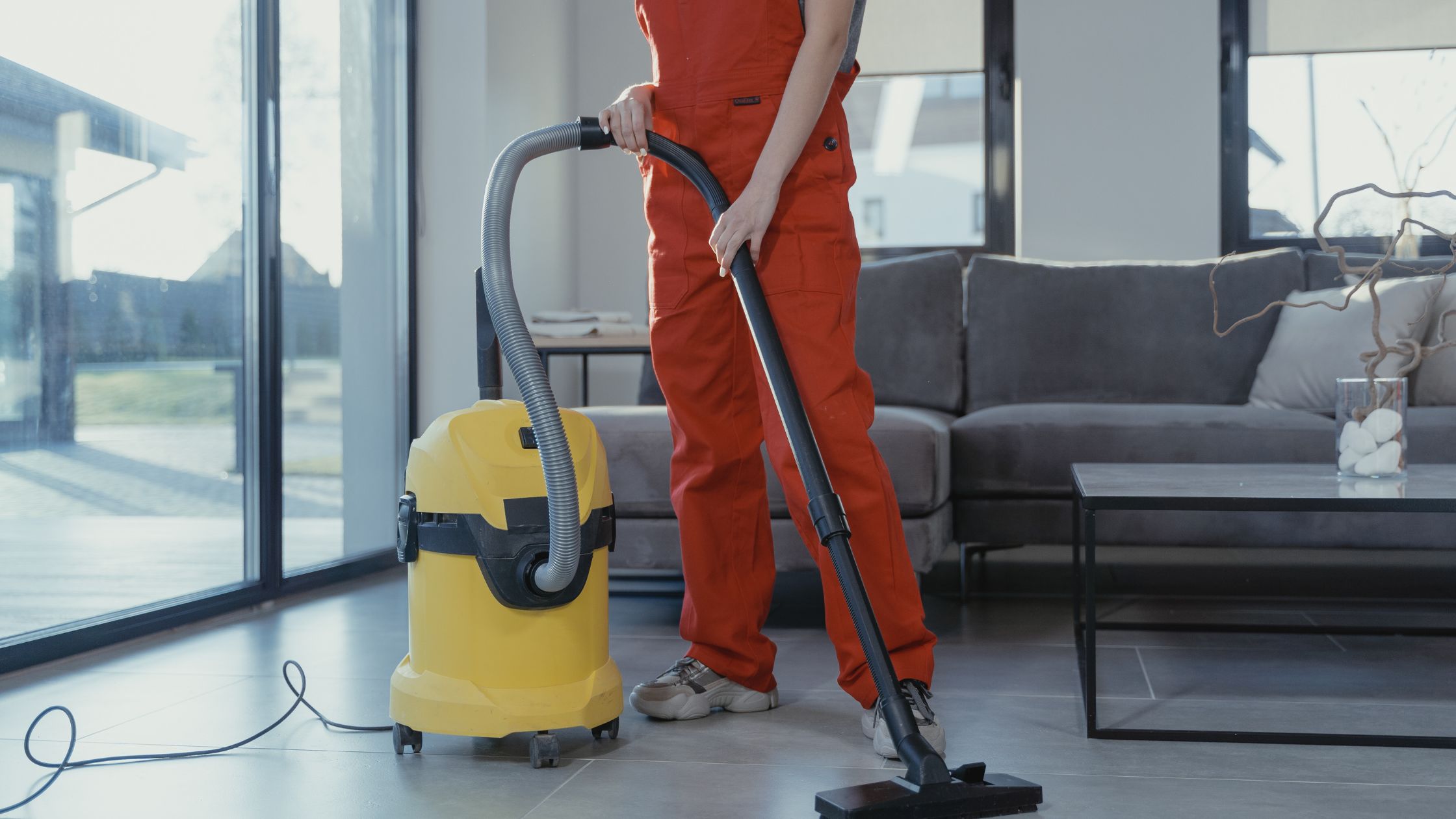 woman using a machine to mop a house