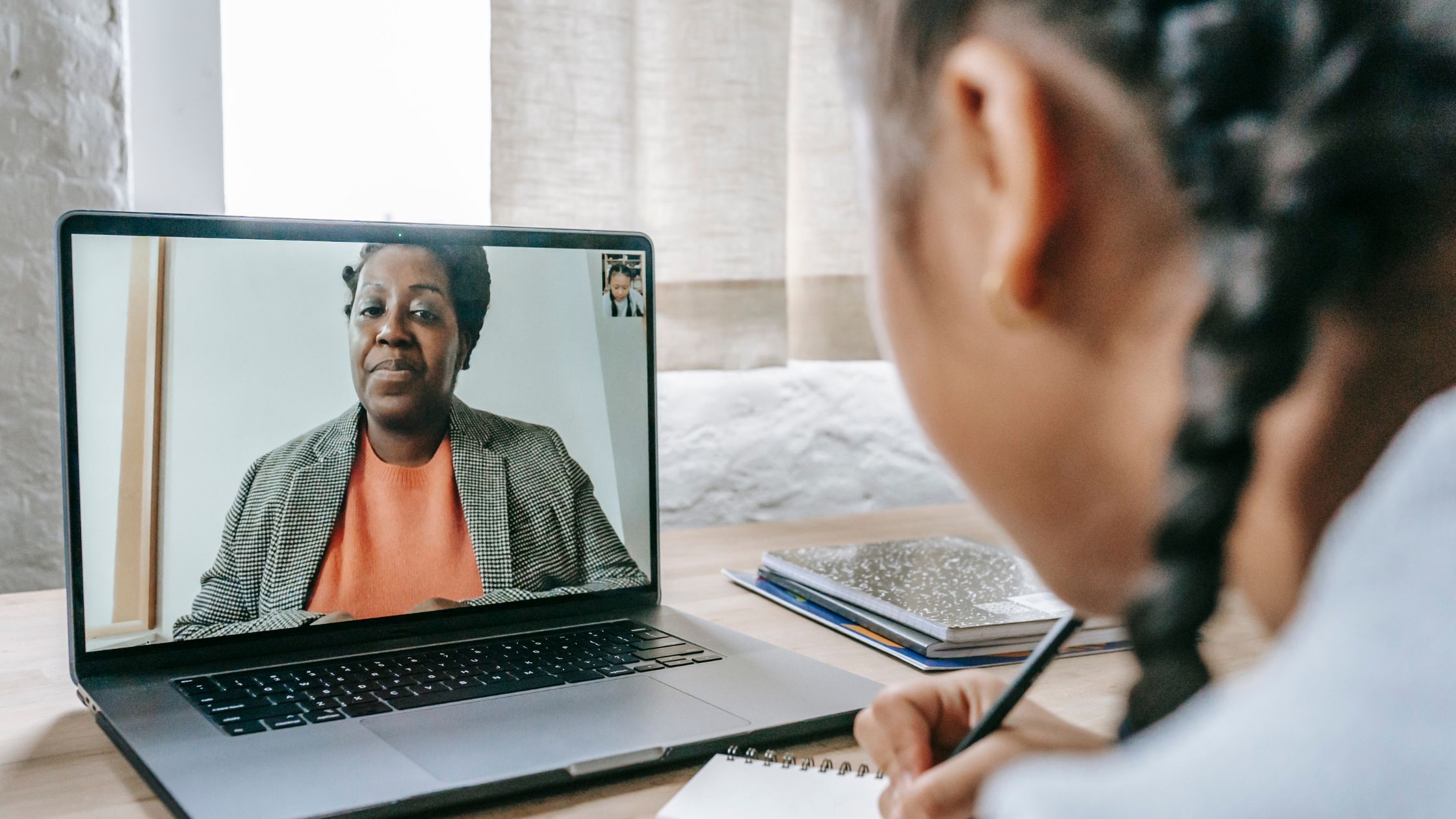 woman tutoring to a student online