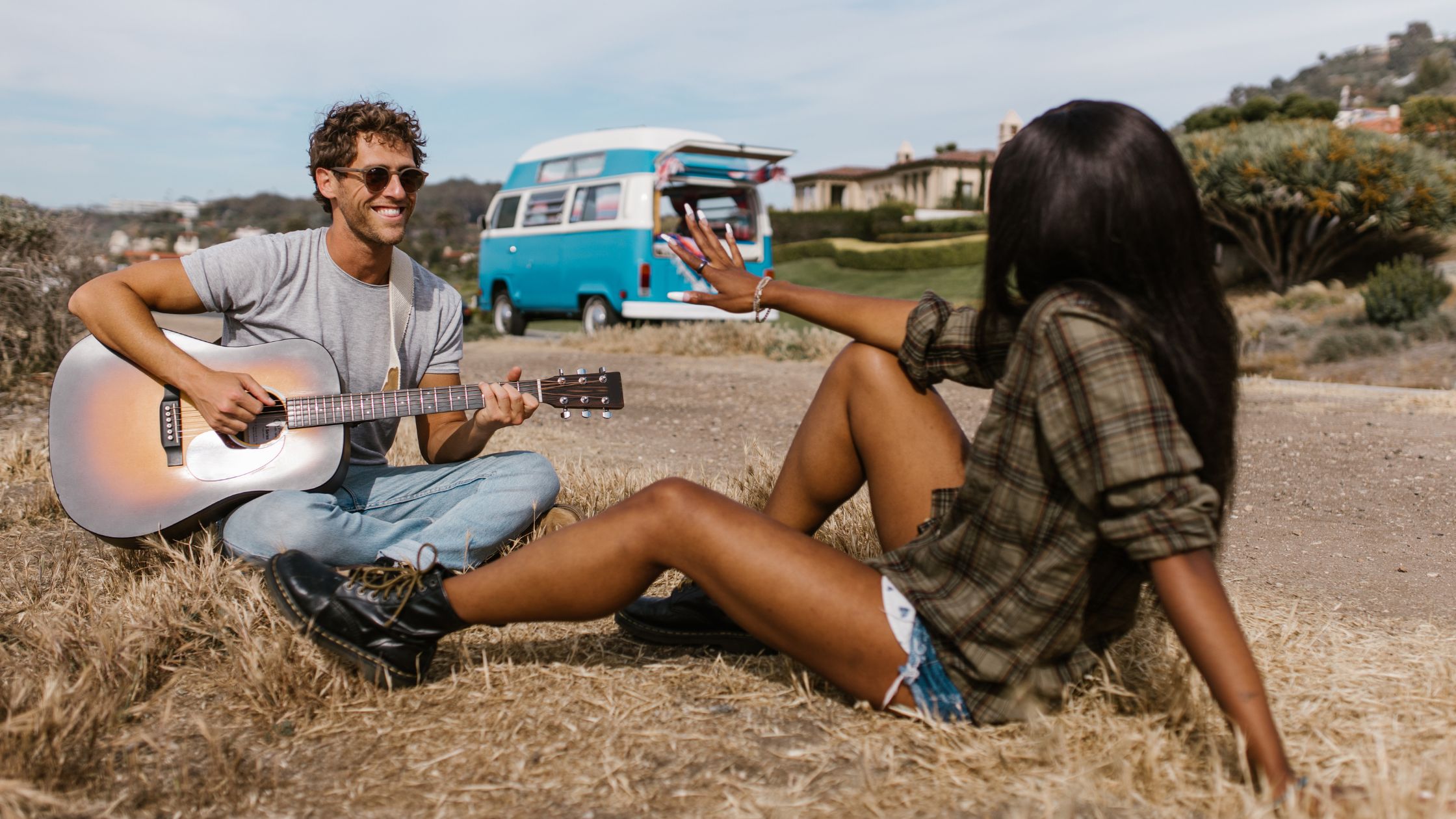 picture of a couple at the country side outside a cargo van