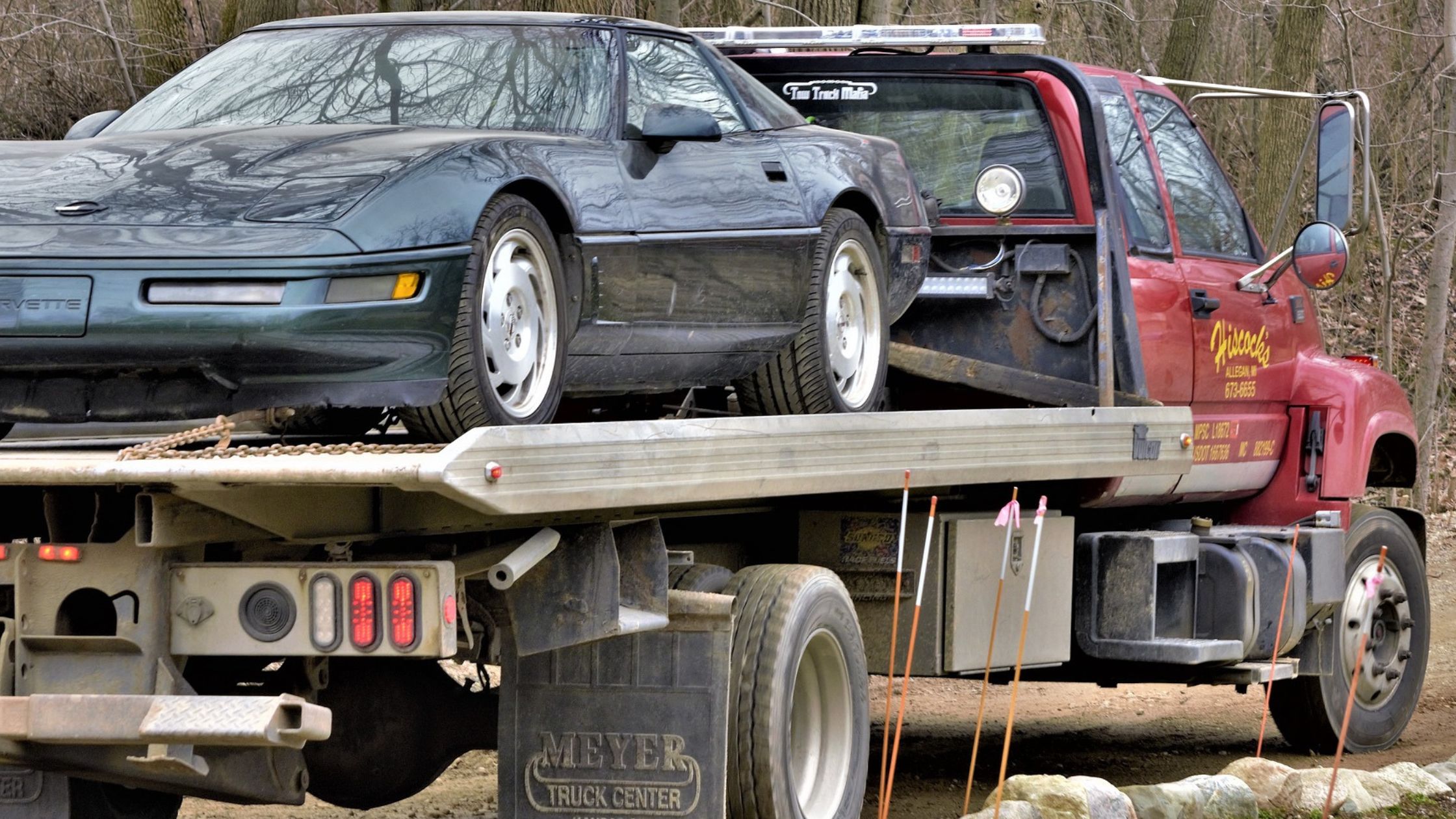 truck transporting a car