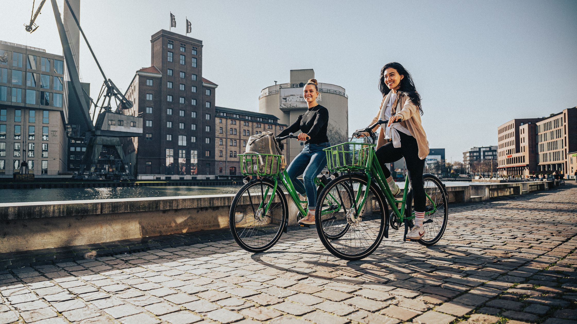 two ladies cycling to work