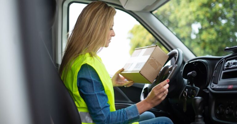 A picture of a driver delivering a package