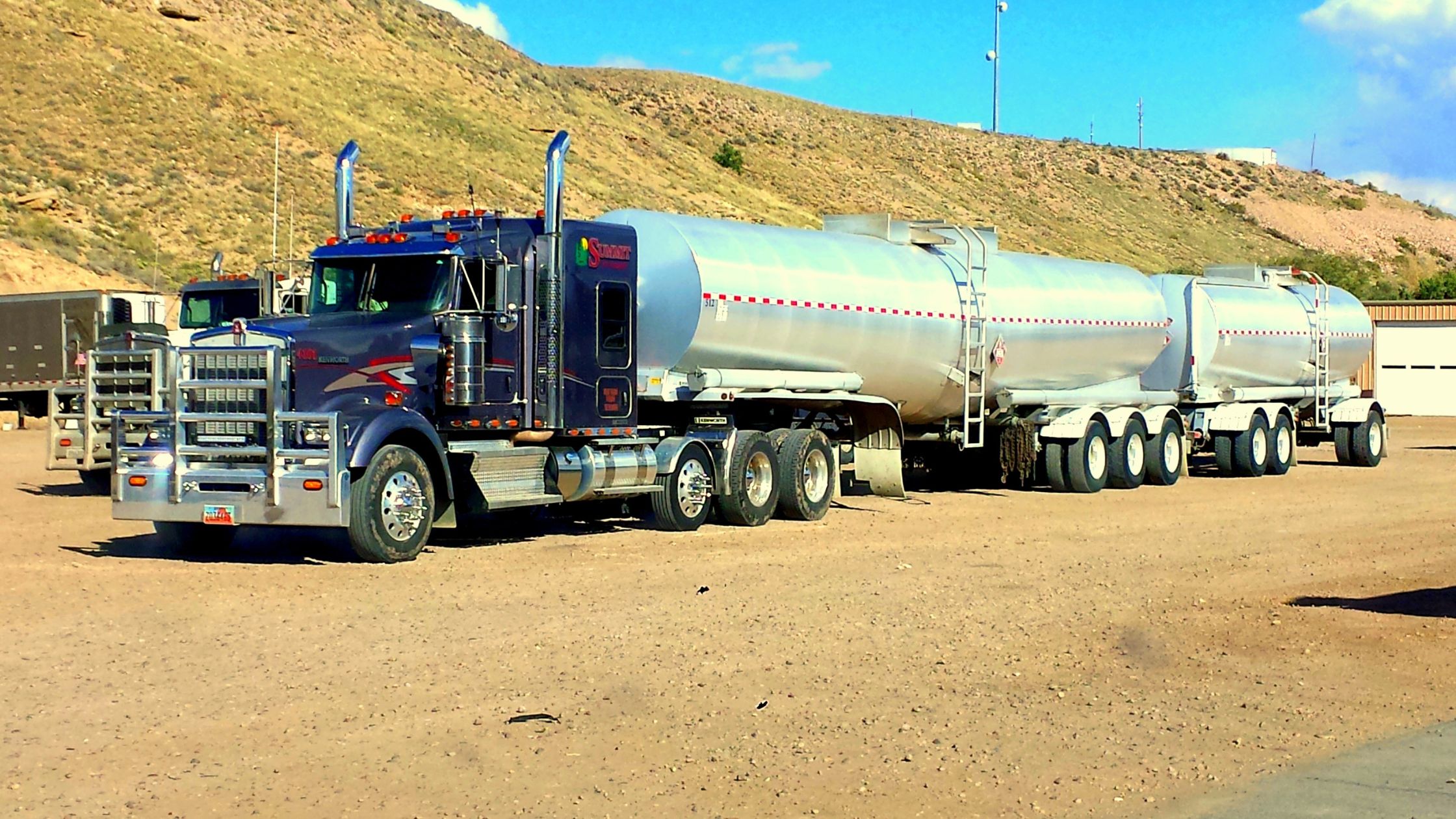 A picture of a truck on the road