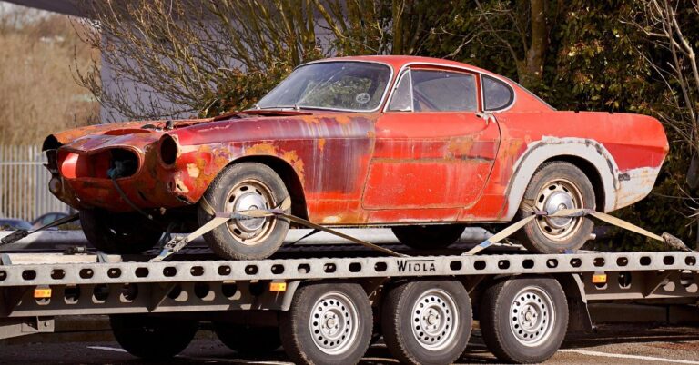 A car on a flatbed towing truck