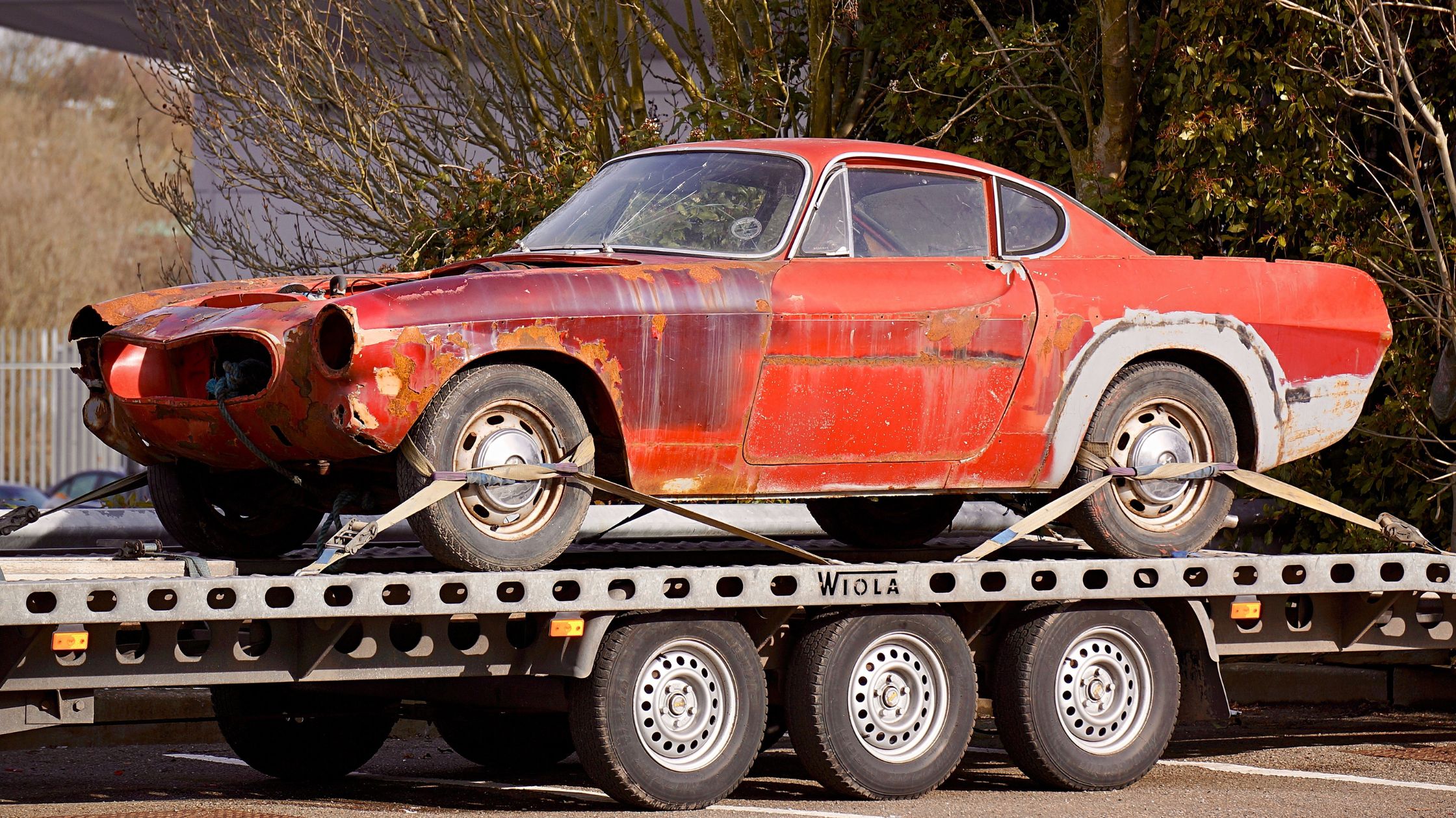 A car towed on a flatbed truck