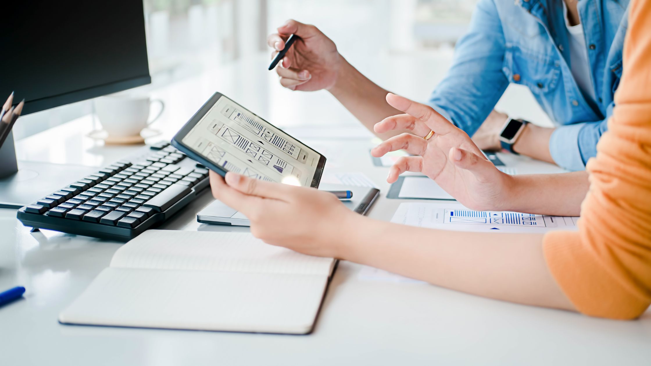 Two ladies designing an SEO work plan