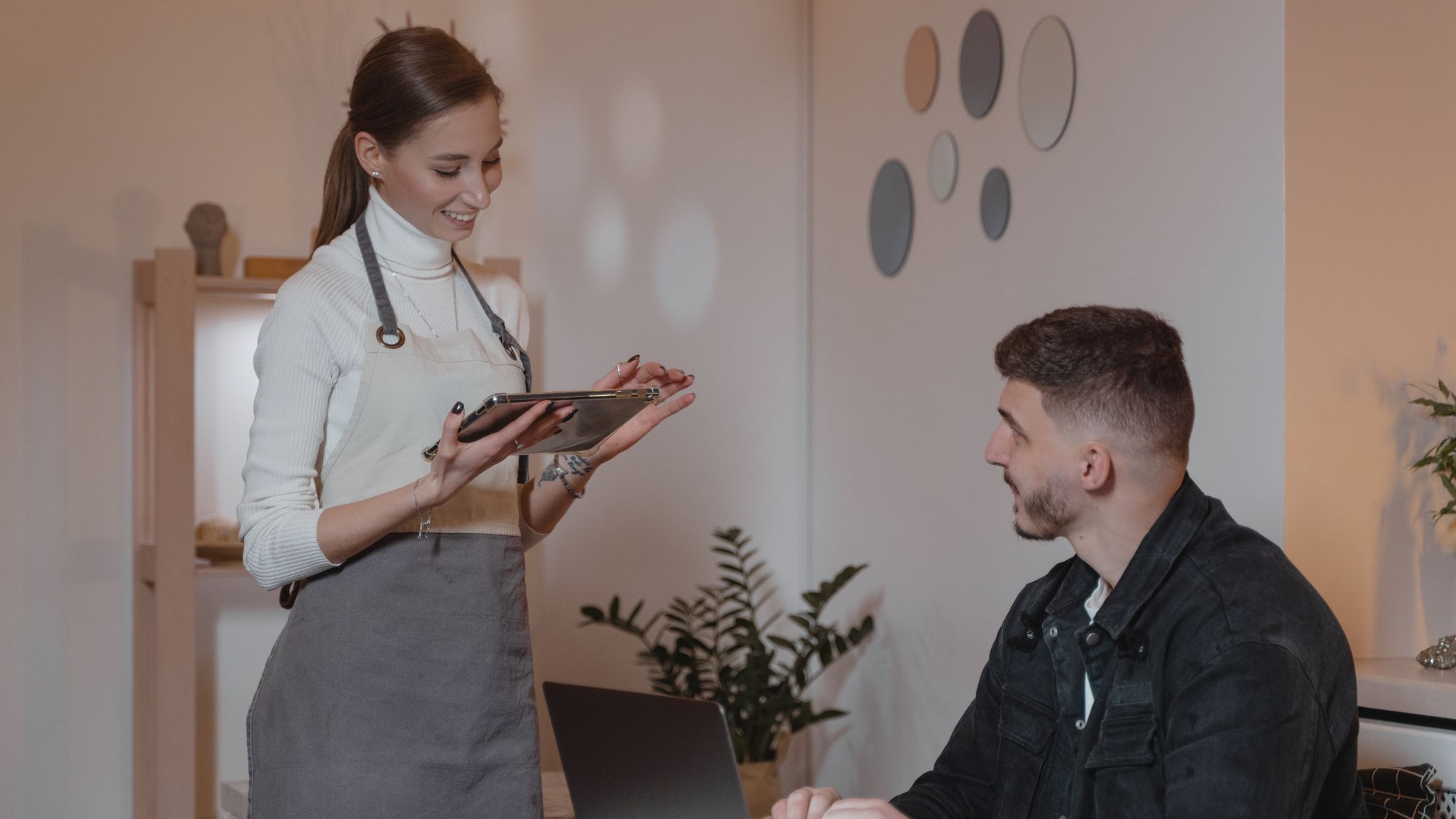 Waitress taking an order from a male client