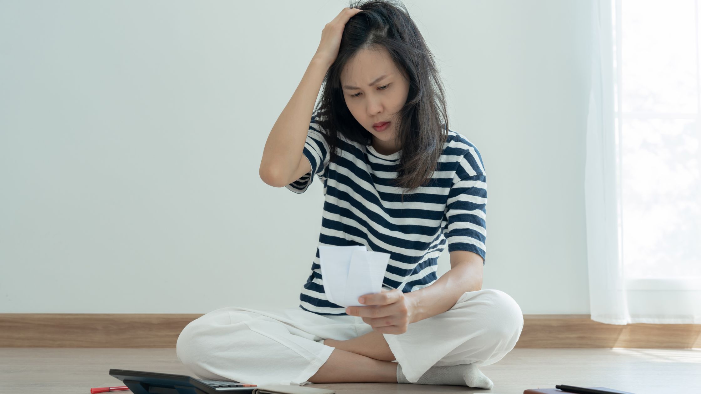 A lady checking receipts